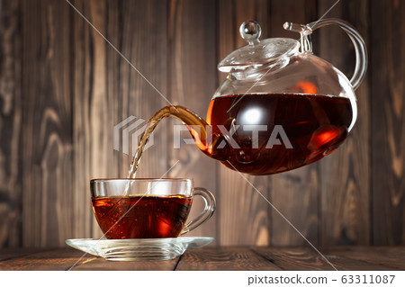 flying teapot pouring tea 63311087
