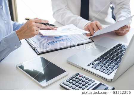 Business team colleagues discussing working 63312296