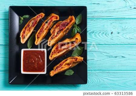 Pizza roll stromboli with cheese salami olives and Pizza roll stromboli with cheese salami olives and 63313586