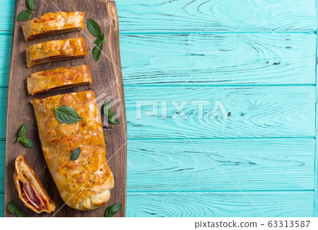 Pizza roll stromboli with cheese salami olives and Pizza roll stromboli with cheese salami olives and 63313587