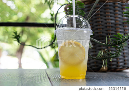 Iced lemonade soda with Yuzu orange 63314556