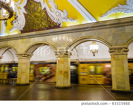 Russia, train passing in Komsomolskaya metro station, one of the most attractive stalinist architecture of Moscow underground Russia, train passing in Komsomolskaya metro station, one of the most attractive stalinist architecture of Moscow underground 63315988