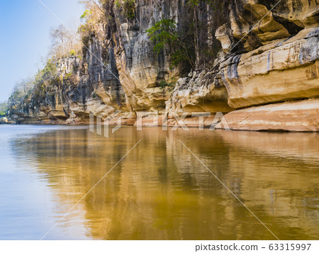 Stunning stone formations reflected on Manambolo river, Tsingy de Bemaraha Strict Nature Reserve, Madagascar Stunning stone formations reflected on Manambolo river, Tsingy de Bemaraha Strict Nature Reserve, Madagascar 63315997