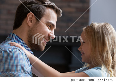 Happy young dad and little girl play girlish game Happy young dad and little girl play girlish game 63316570