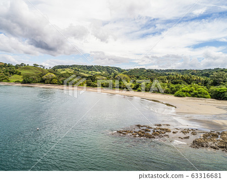 Aerial shot of the tropical beach Playa Arenillas in Costa Rica in peninsula Papagayo coast in guanacaste Aerial shot of the tropical beach Playa Arenillas in Costa Rica in peninsula Papagayo coast in guanacaste 63316681