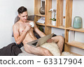 Naked sexy guy works at home with laptop 63317904