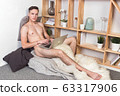 Naked sexy guy works at home with laptop 63317906