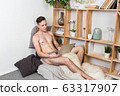 Naked sexy guy works at home with laptop 63317907