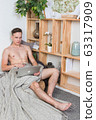 Naked sexy guy works at home with laptop 63317909