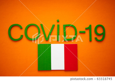 Italian Flag And Inscription COVID-19 on orange background. World Health Organization WHO introduced new official name for Coronavirus disease named COVID-19 63318745