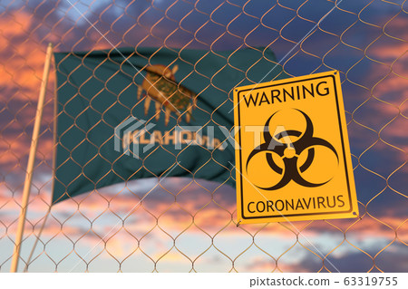 Biohazard coronavirus sign against flying flag of Oklahoma. Quarantine related 3D rendering 63319755