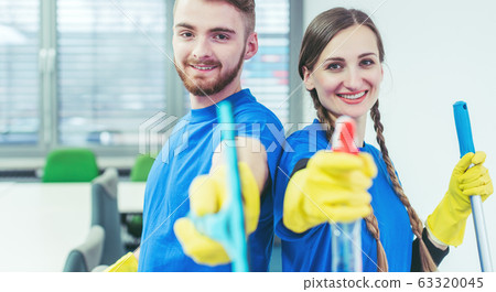 Woman and man in commercial cleaner team 63320045