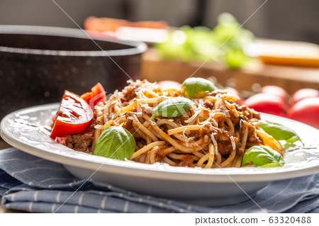 Italian pasta spaghetti bolognese served on white 63320488