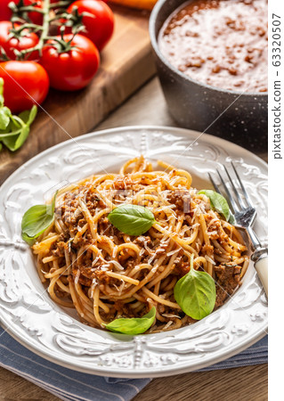 Italian pasta spaghetti bolognese served on white Italian pasta spaghetti bolognese served on white 63320507