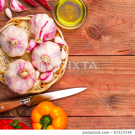 Culinary background garlic, pepper on a wooden Culinary background garlic, pepper on a wooden 63323549