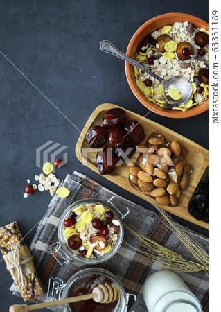 Healthy breakfast. Muesli from cereals with milk berries. 63331189