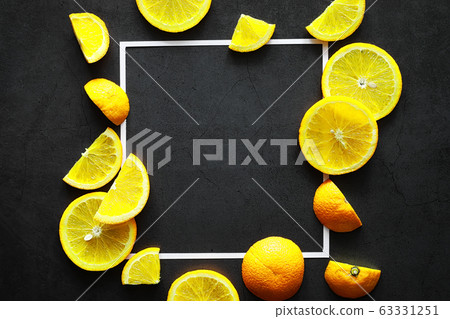 Orange citrus fruit on a stone table. Orange background. 63331251