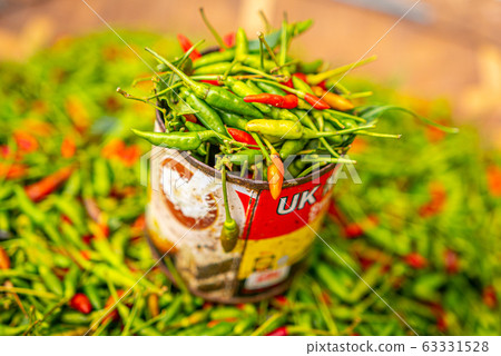 Red and green chili pepper in tin can, local organic market 63331528