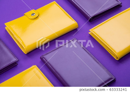 flat lay handmade purple and yellow purse on a matte table flat lay handmade purple and yellow purse on a matte table 63333241
