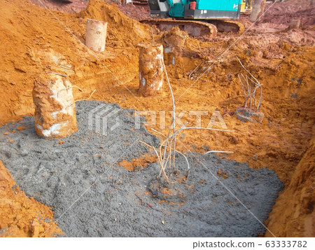 Bore pile cut to level by the construction workers. It will continue by pile cap and ground beam works. Bore pile cut to level by the construction workers. It will continue by pile cap and ground beam works. 63333782