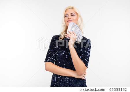 successful business woman with money in hands on a white background successful business woman with money in hands on a white background 63335162