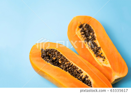 Ripe papaya on blue background 63335617