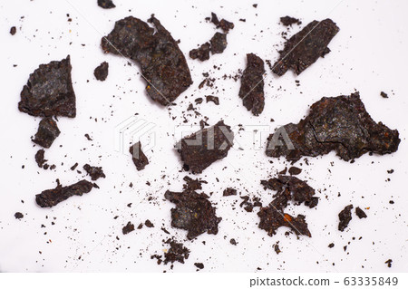 Pieces of Rusty metal texture on white acrylic, Abstract background, Close up shot, Selective focus, Industry concept 63335849