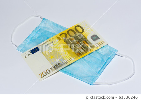 Protective medical mask and euro bills. Expensive 63336240