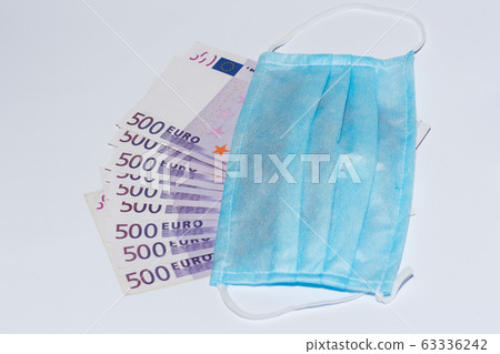 Protective medical mask and euro bills. Expensive Protective medical mask and euro bills. Expensive 63336242