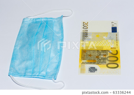 Protective medical mask and euro bills. Expensive Protective medical mask and euro bills. Expensive 63336244