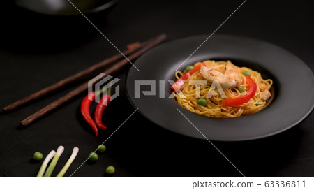 Cropped shot of Schezwan Noodles or Chow Mein with Cropped shot of Schezwan Noodles or Chow Mein with 63336811