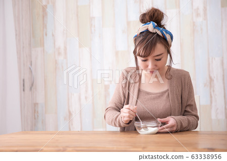 Woman in room wear Woman in room wear 63338956