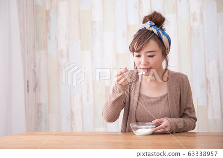 Woman in room wear Woman in room wear 63338957