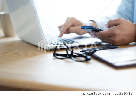 Male hand PC smartphone 63339718