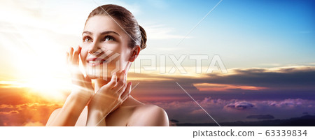 Double exposure of beautiful woman face and sunset sky. 63339834