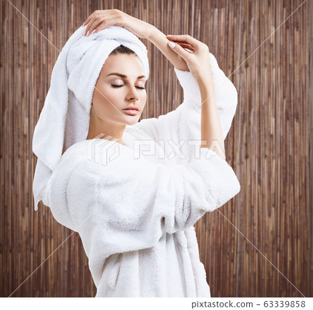 Young sensual woman with bath towel on head. Young sensual woman with bath towel on head. 63339858