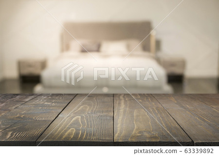 Empty wooden board and blurred modern bedroom with house interior as background. Abstract pattern. 63339892