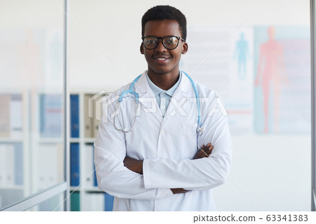 Young African Doctor Posing in Clinic 63341383