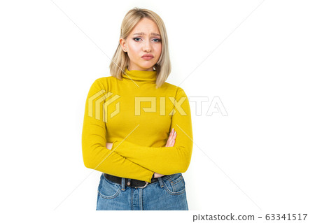 indignant offended girl in casual style on a white background 63341517