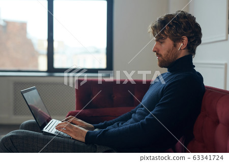 Side View at Handsome Man Using Laptop Side View at Handsome Man Using Laptop 63341724