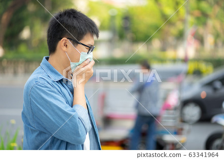HandsomeMan wearing face mask protect filter HandsomeMan wearing face mask protect filter 63341964
