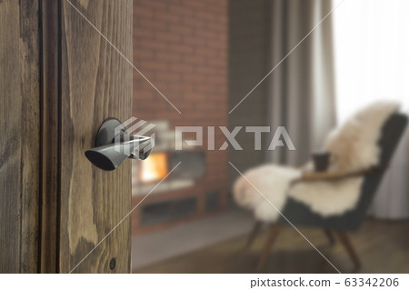 Open door and view to farm living room  63342206