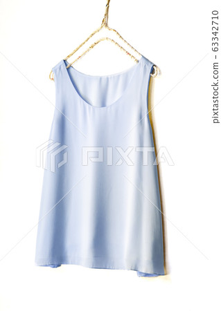 Light blue tank top on a hanger 63342710