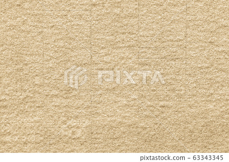 Granite tiled wall background rough texture in natural light yellow cream color 63343345