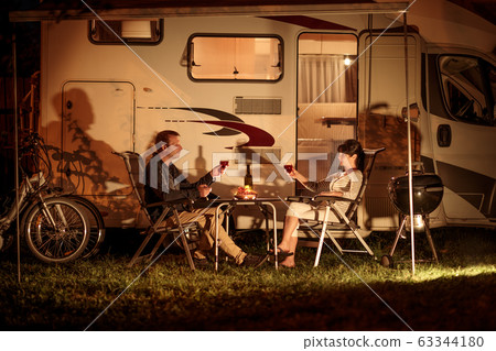 Adult couple clinking glasses of wine. Family 63344180