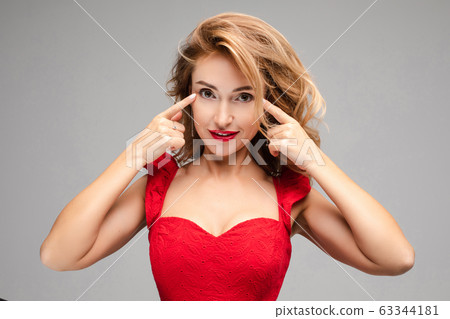 Handsome lady shows her wonderful long fair hair 63344181