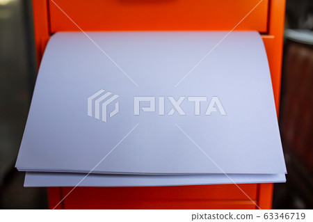 Filing cabinet with open drawer, White papers  for write letter, Orange metal colour, Administration and storage concept, closeup & Macro shot, Selective focus 63346719