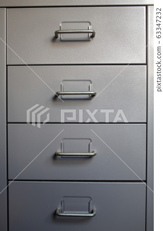Filing cabinet with closed drawer, Grey silver metal colour, Administration and storage concept Filing cabinet with closed drawer, Grey silver metal colour, Administration and storage concept 63347232