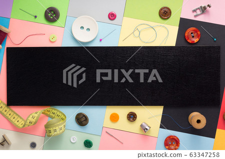 sewing tools and accessories at paper background 63347258