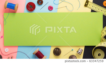 sewing tools and accessories at paper background 63347259